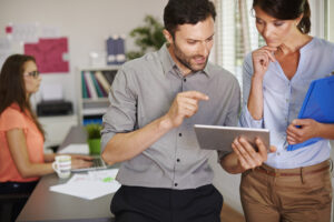 Social media consultants collaborating on content strategy, analytics, and digital marketing planning.